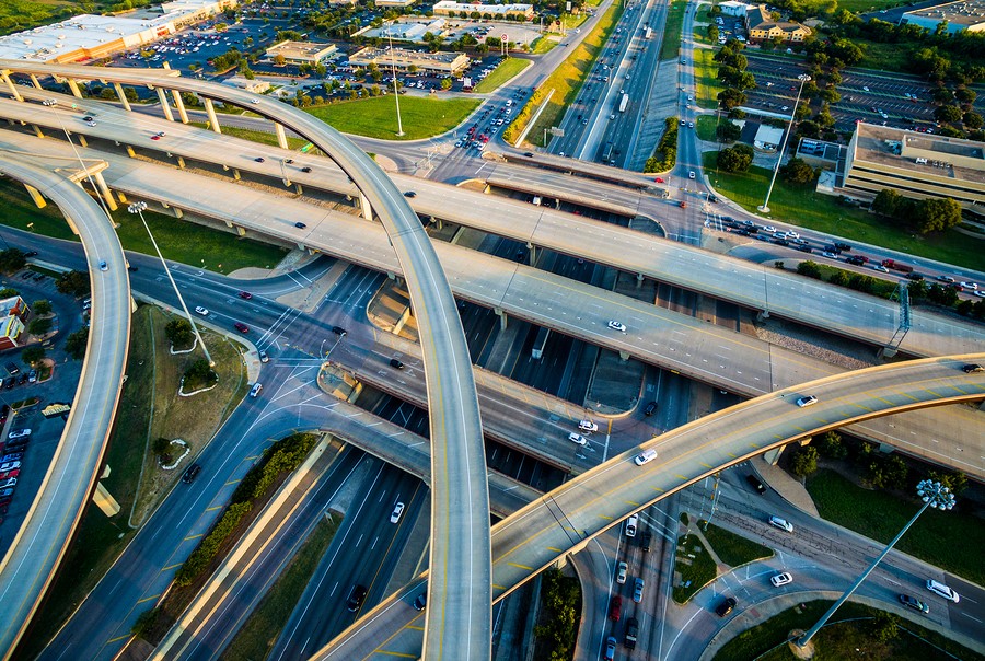 Stock image of a multilane highway interchange.